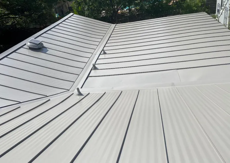 Solar attic fan installed on a metal roof for Roof Ventilation in Maple Valley